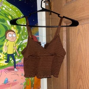 Brown sleeveless crop top shirt.
